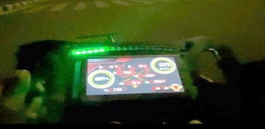 Steering wheel display with LED strip active during low-light testing.