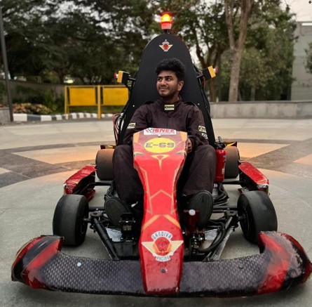 Electric go-kart on track during competition.